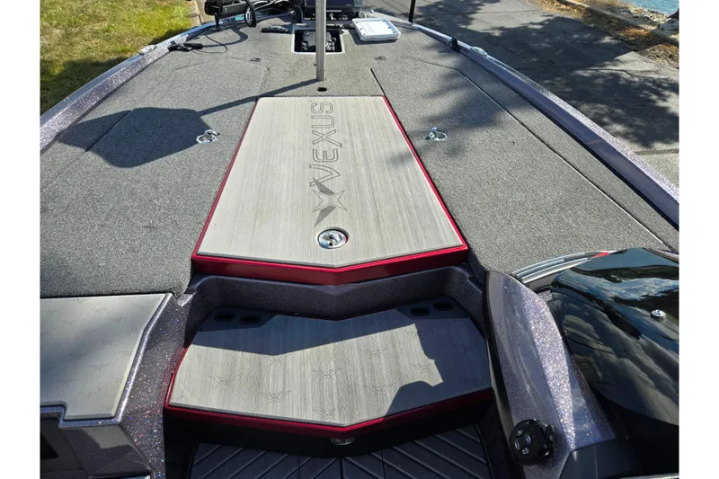 Slide: The Image of 2022 Vexus VX20 boat deck with storage compartments and sleek design. - 15