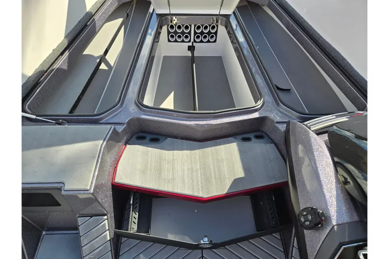 Slide: The Image of 2022 Vexus VX20 boat interior with open storage compartments and sleek design. - 16