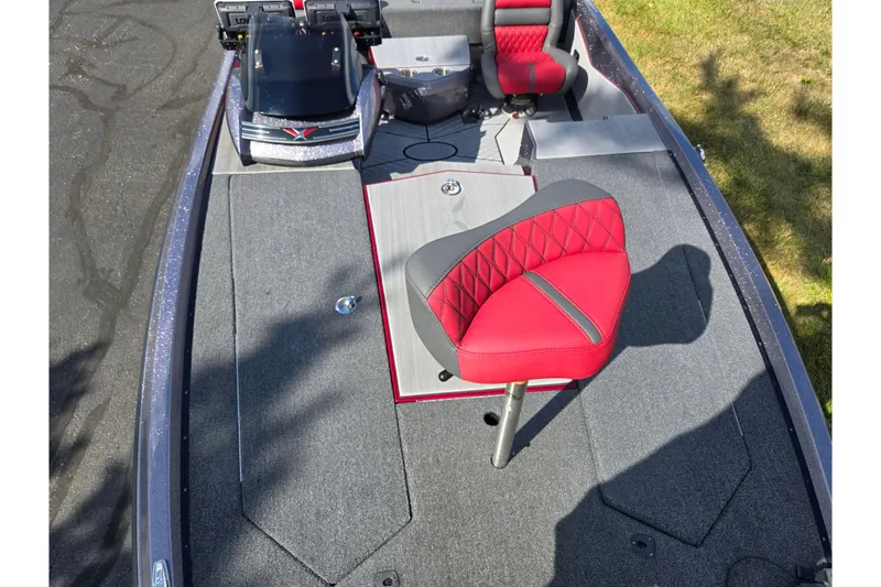 Slide: The Image of 2022 Vexus VX20 boat interior with red and gray seating, featuring advanced controls. - 18