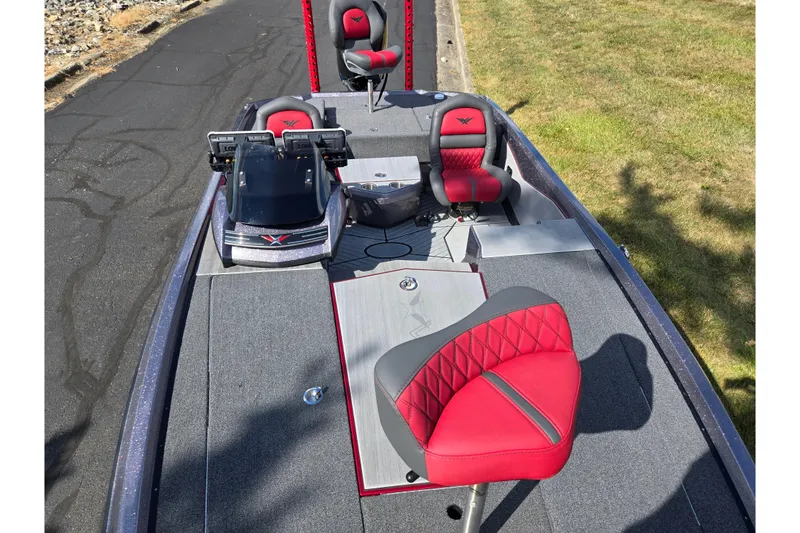 Slide: The Image of 2022 Vexus VX20 boat interior with red and gray seating, dual monitors, and spacious deck. - 19