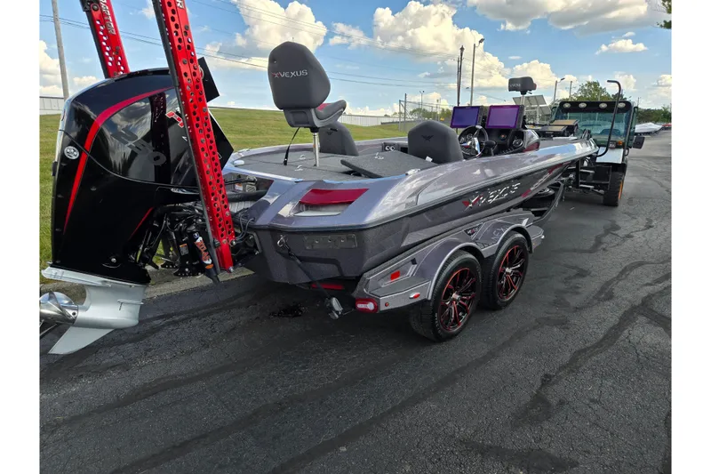 Slide: The Image of 2022 Vexus VX20 boat on trailer, featuring sleek design and powerful outboard motor. - 3