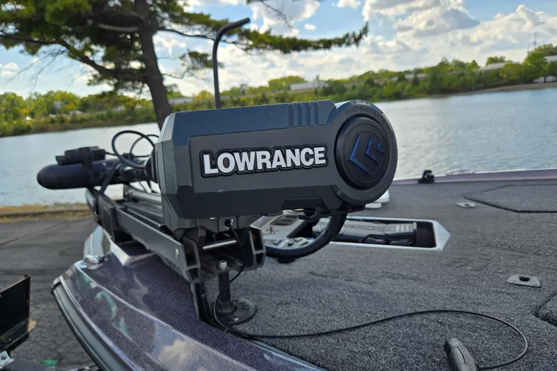 Slide: The Image of 2022 Vexus VX20 boat with Lowrance equipment by a scenic lake. - 8