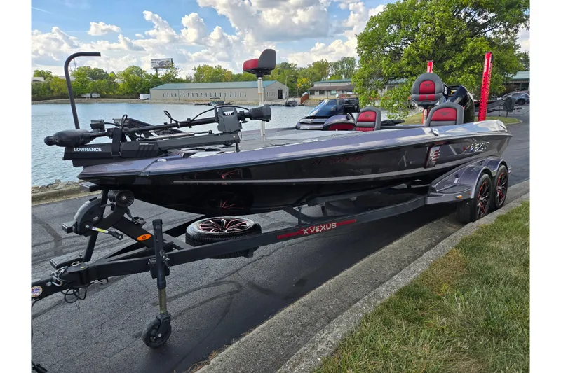 Slide: The Image of 2022 Vexus VX20 boat on trailer by lakeside, featuring Lowrance equipment. - 9