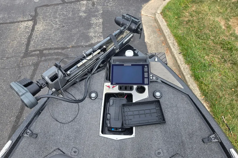 Slide: The Image of 2022 Vexus VX20 boat deck with navigation equipment and storage compartments. - 16