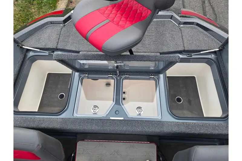 Slide: The Image of 2022 Vexus VX20 boat interior with open storage compartments and red-gray seating. - 22