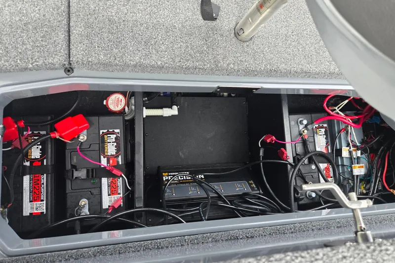 Slide: The Image of 2022 Vexus VX20 battery compartment with ProGuide batteries and wiring setup. - 23