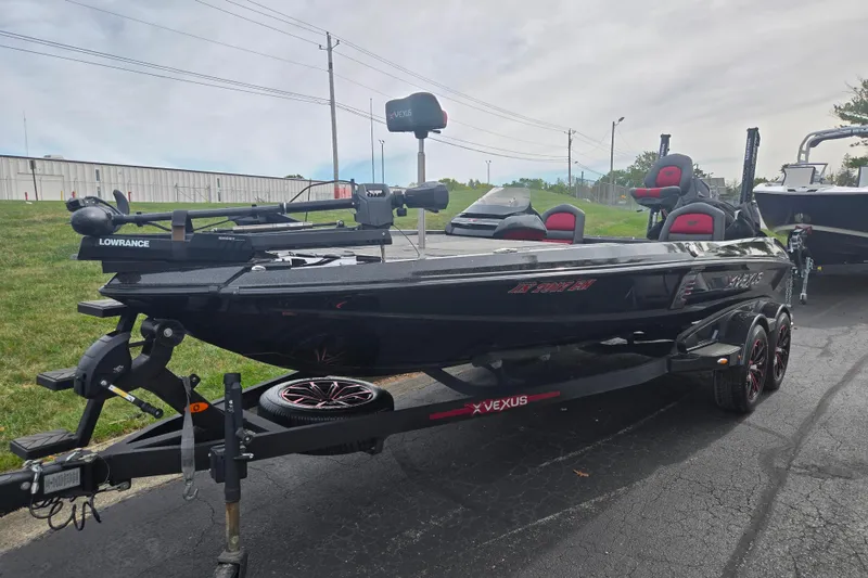 Slide: The Image of 2022 Vexus VX20 boat on trailer, featuring Lowrance equipment, parked outdoors. - 6