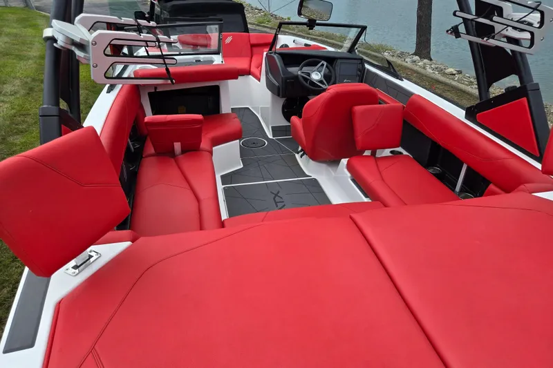 Slide: The Image of 2022 ATX Surf Boats 20 Type-S interior with vibrant red seating and modern design. - 11