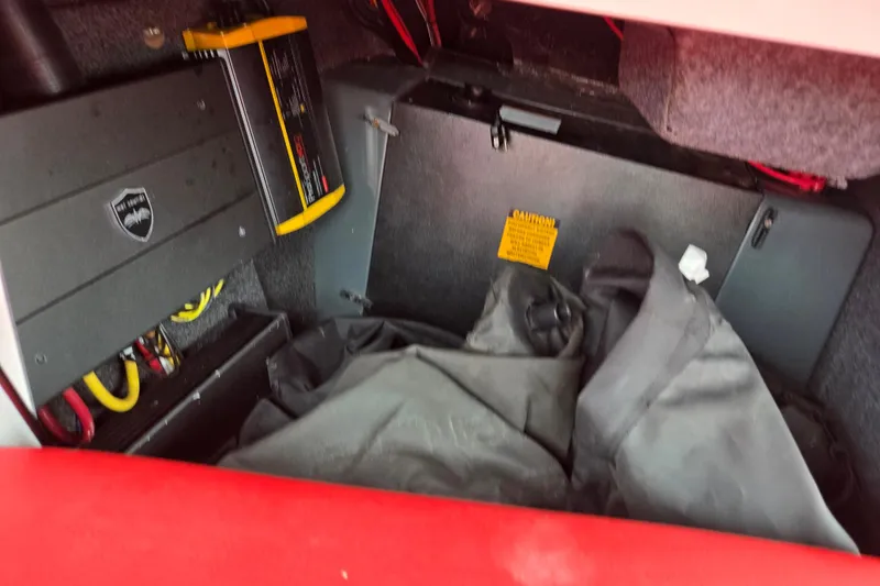 Slide: The Image of Interior storage compartment of 2022 ATX Surf Boats 20 Type-S with equipment and cables. - 14