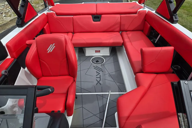 Slide: The Image of 2022 ATX Surf Boats 20 Type-S interior with vibrant red seating and modern design. - 20