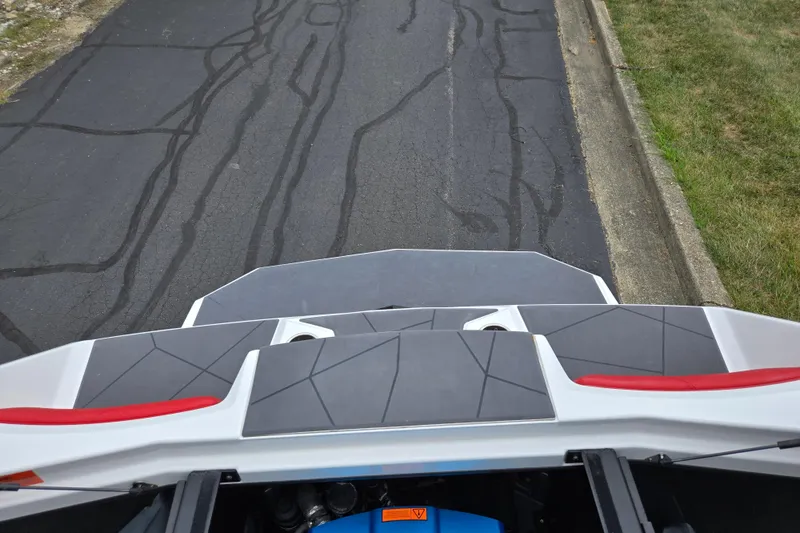 Slide: The Image of 2022 ATX Surf Boats 20 Type-S rear deck view on pavement. - 25