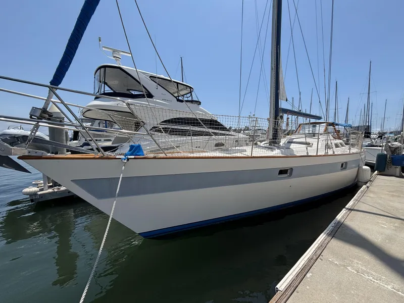 The Image of 1982 Norseman 447 sailboat docked at marina under clear blue sky. - 0
