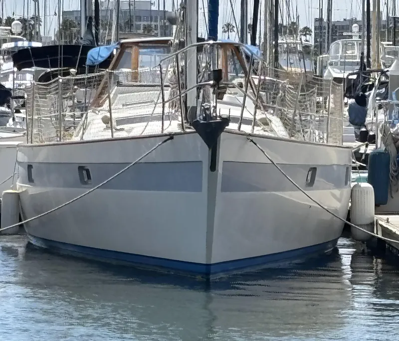 Slide: The Image of 1982 Norseman 447 sailboat docked in a marina, front view. - 1