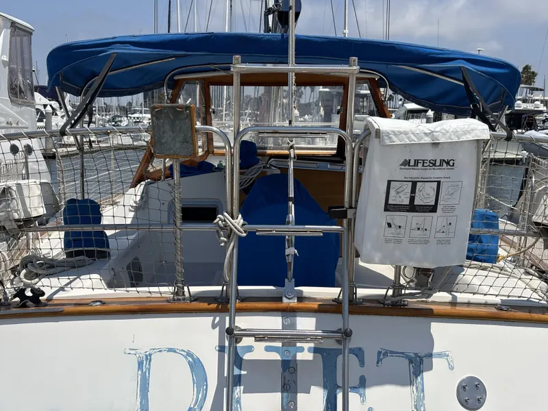 Slide: The Image of Sailboat Norseman 447, 1982 model, docked with Lifesling safety equipment visible. - 14