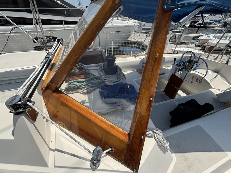 Slide: The Image of Cockpit of 1982 Norseman 447 sailboat with wooden trim and nautical equipment. - 17