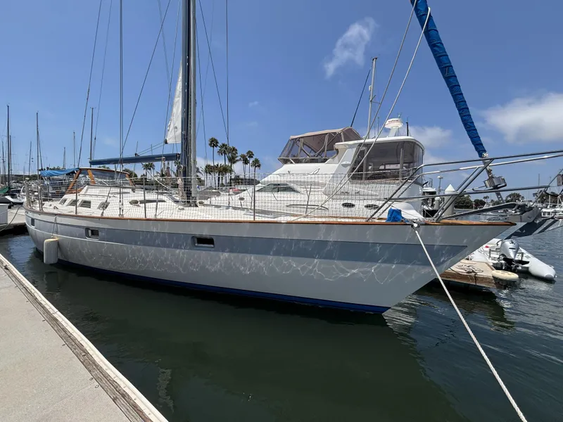 Slide: The Image of Sailboat docked at marina, Norseman 447, 1982 model, under clear blue sky. - 2