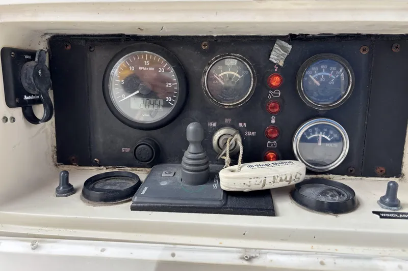 Slide: The Image of Control panel of a 1982 Norseman 447 boat with gauges and switches. - 24