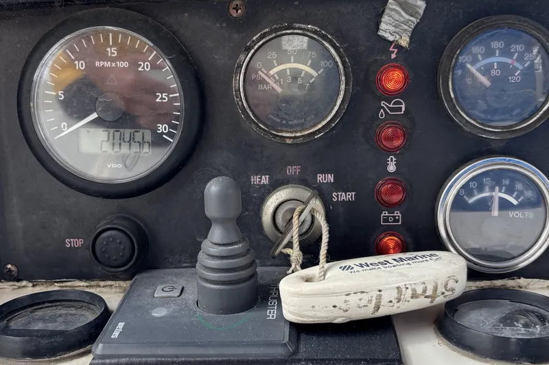 Slide: The Image of Control panel of a 1982 Norseman 447 boat with gauges and switches. - 25