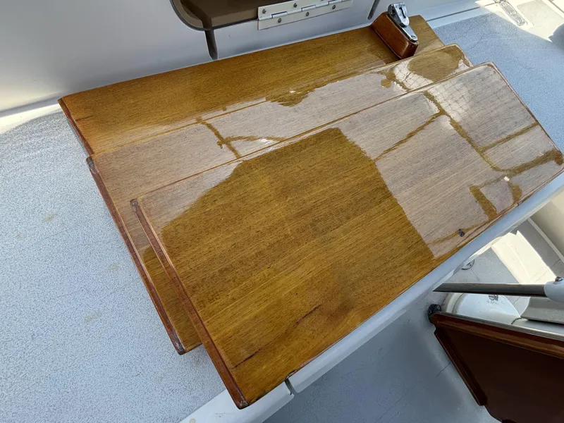 Slide: The Image of Polished wooden table on a 1982 Norseman 447 boat deck. - 27