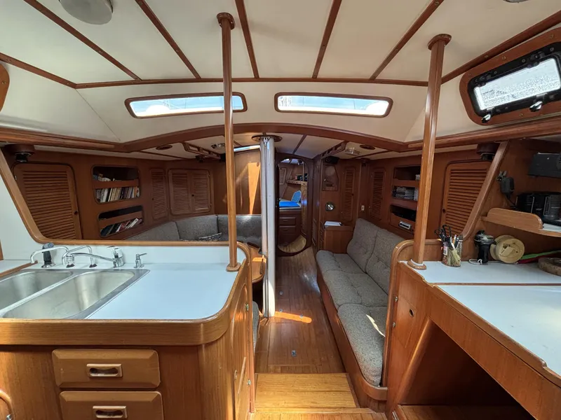Slide: The Image of Interior of 1982 Norseman 447 sailboat with wood finish and cozy seating area. - 31