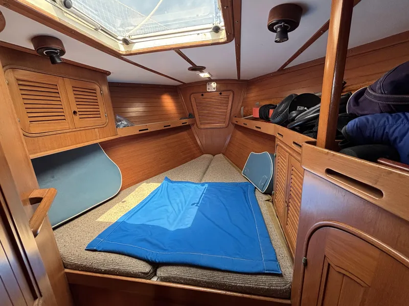 Slide: The Image of Cozy cabin interior of 1982 Norseman 447 sailboat with wooden finish and skylight. - 38