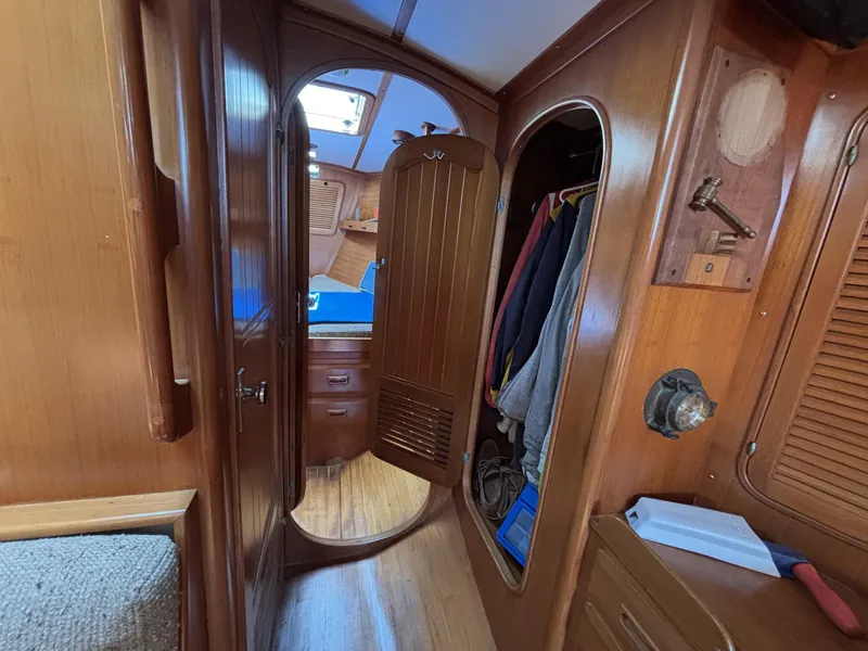Slide: The Image of Interior of 1982 Norseman 447 sailboat with wooden cabinetry and cozy cabin space. - 40