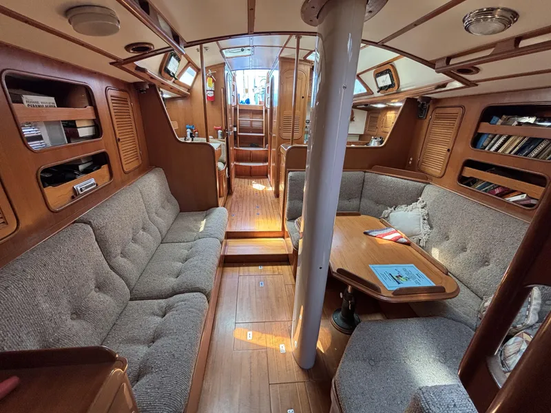 Slide: The Image of Interior of 1982 Norseman 447 sailboat with cozy seating and wooden finishes. - 45