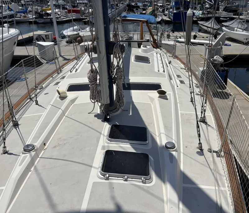Slide: The Image of Deck view of 1982 Norseman 447 sailboat docked at a marina. - 7
