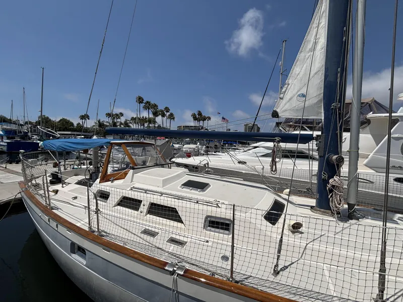 Slide: The Image of 1982 Norseman 447 sailboat docked at marina under clear blue sky. - 8