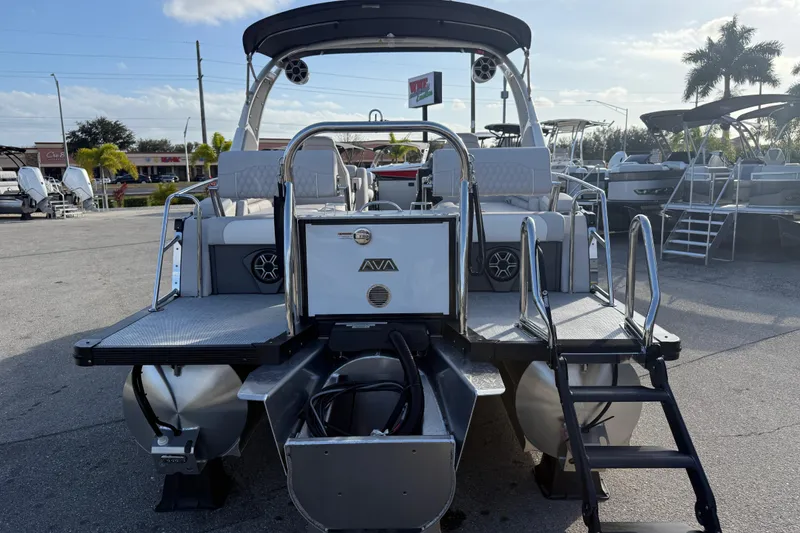 Slide: The Image of 2026 Avalon 2385 Catalina Quad Lounger Tri Toon boat displayed at a dealership. - 11