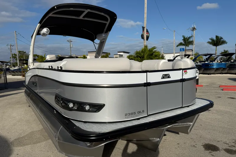 Slide: The Image of 2026 Avalon 2385 Catalina Quad Lounger, Tri Toon High Performance boat in a sunny marina. - 6