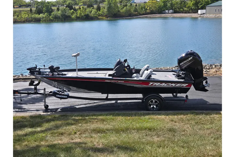 The Image of 2018 Tracker Pro Team 195 TXW 40th Anniversary Edition boat by a lake. - 0