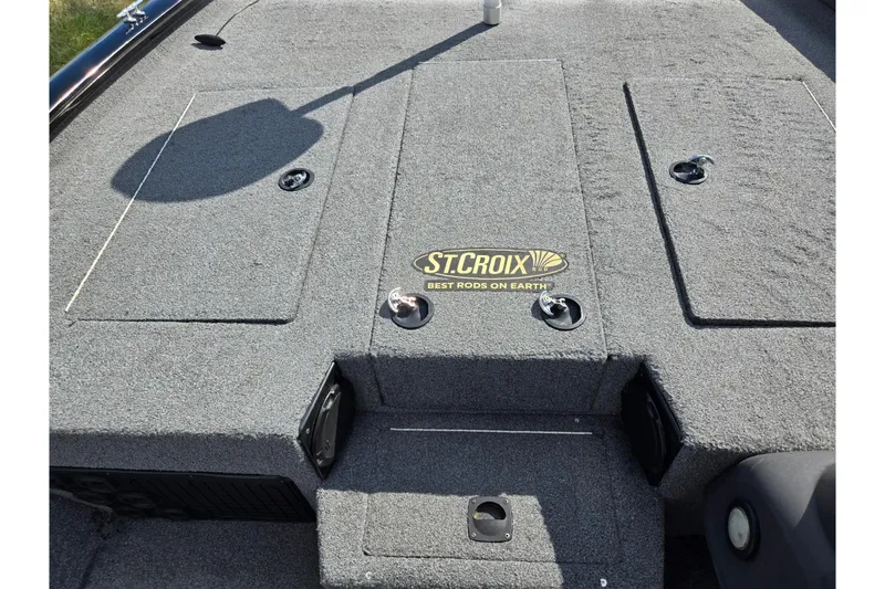 Slide: The Image of 2018 Tracker Pro Team 195 TXW boat deck with St. Croix logo, gray carpeted surface. - 14