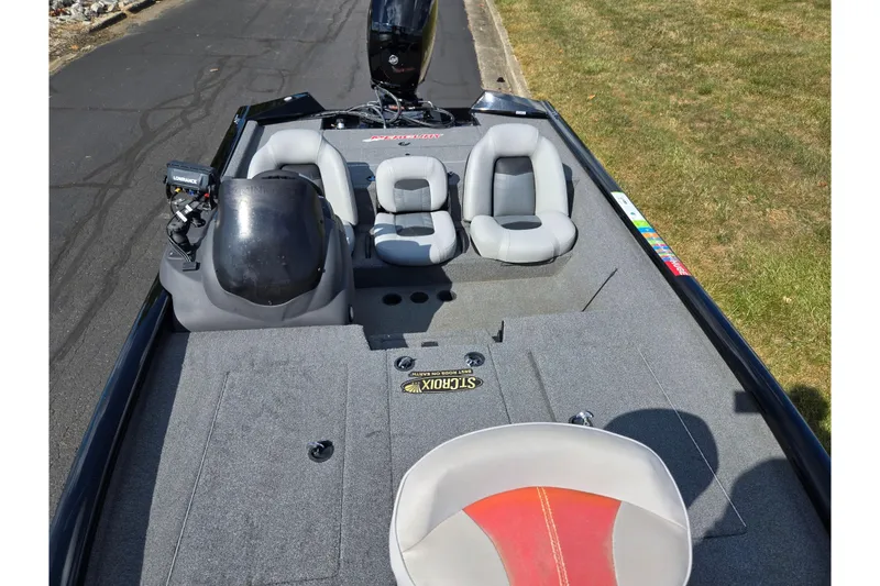 Slide: The Image of 2018 Tracker Pro Team 195 TXW 40th Anniversary Edition boat interior with seating and equipment. - 18