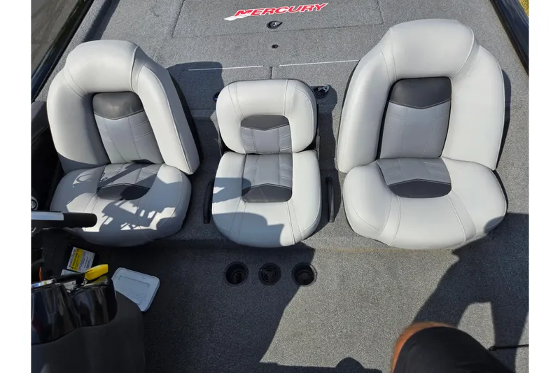 Slide: The Image of 2018 Tracker Pro Team 195 TXW boat seats, gray upholstery, Mercury branding visible. - 19