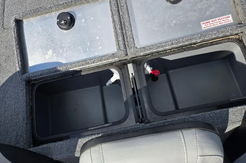 Slide: The Image of 2018 Tracker Pro Team 195 TXW storage compartments with pump-out feature. - 20