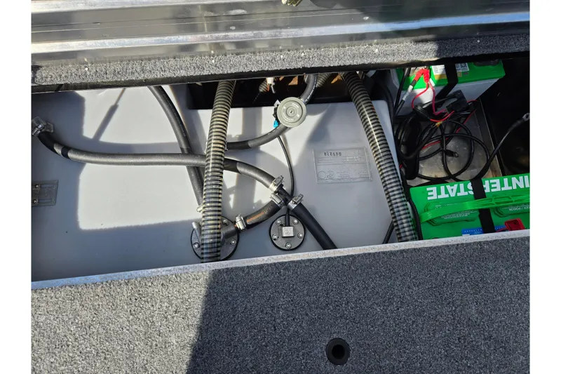 Slide: The Image of 2018 Tracker Pro Team 195 TXW boat interior showing battery and wiring components. - 22