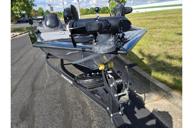 Slide: The Image of 2018 Tracker Pro Team 195 TXW 40th Anniversary Edition boat on trailer, parked outdoors. - 6