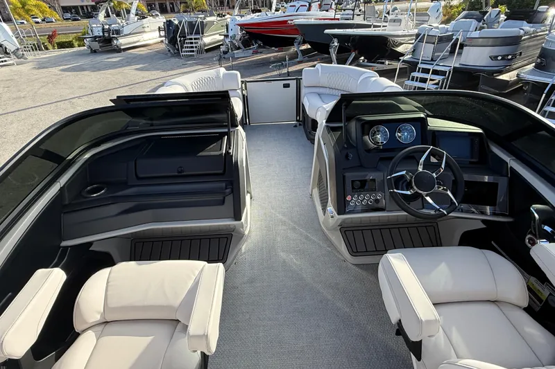 Slide: The Image of 2026 Avalon 2585 Catalina boat interior with luxurious seating and modern dashboard. - 15