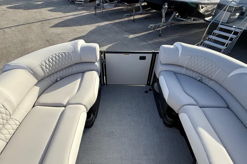 Slide: The Image of Luxurious seating on 2026 Avalon 2585 Catalina Windshield Quad Lounger boat, featuring elegant upholstery. - 19