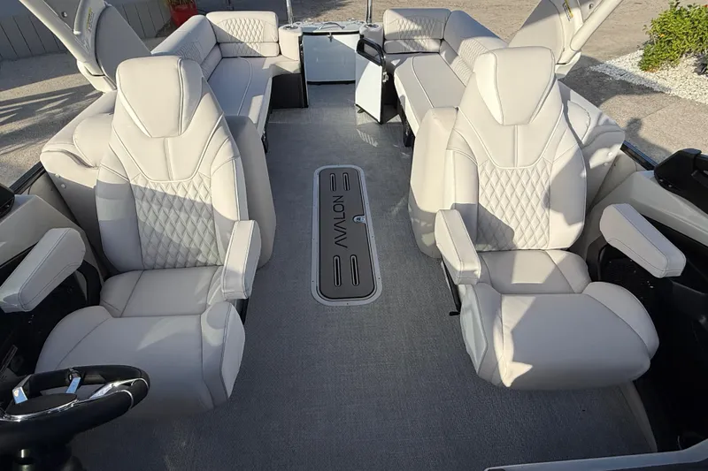 Slide: The Image of Luxurious interior of 2026 Avalon 2585 Catalina Windshield Quad Lounger with plush seating. - 21