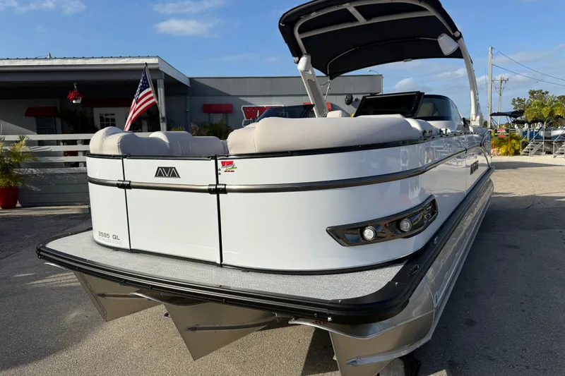 Slide: The Image of 2026 Avalon 2585 Catalina Windshield Quad Lounger with Mercury 400hp V-10 motor, docked. - 3