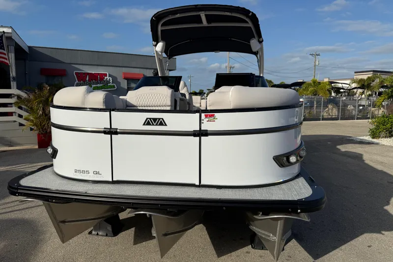 Slide: The Image of 2026 Avalon 2585 Catalina Windshield Quad Lounger with Mercury 400hp V-10 motor, docked outdoors. - 4