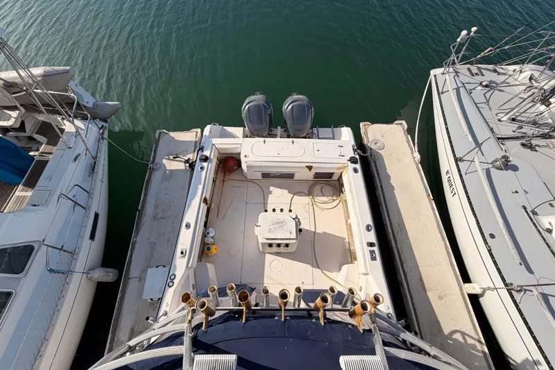Slide: The Image of Overhead view of 1993 Grady-White Marlin 300 docked between boats. - 13