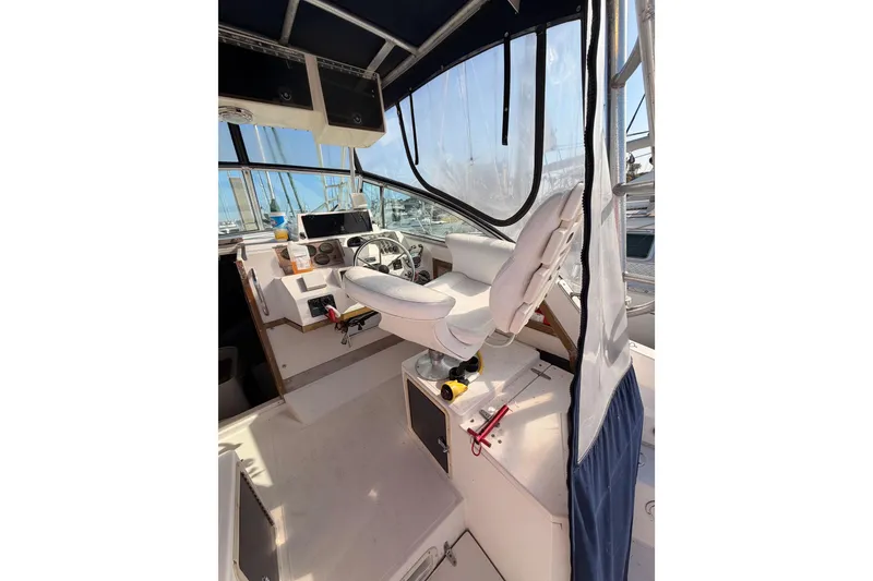 Slide: The Image of Interior of 1993 Grady-White Marlin 300 boat with helm and seating area. - 18