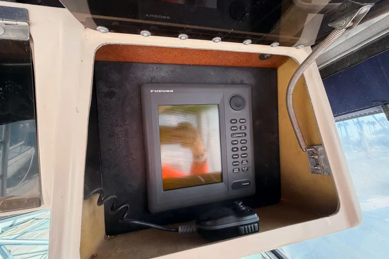 Slide: The Image of Furuno marine electronics on 1993 Grady-White Marlin 300 boat dashboard. - 22