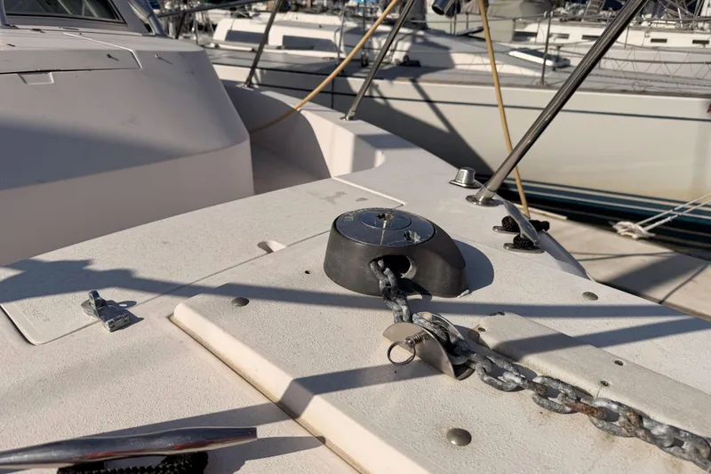 Slide: The Image of 1993 Grady-White Marlin 300 boat deck with anchor chain and fittings. - 38