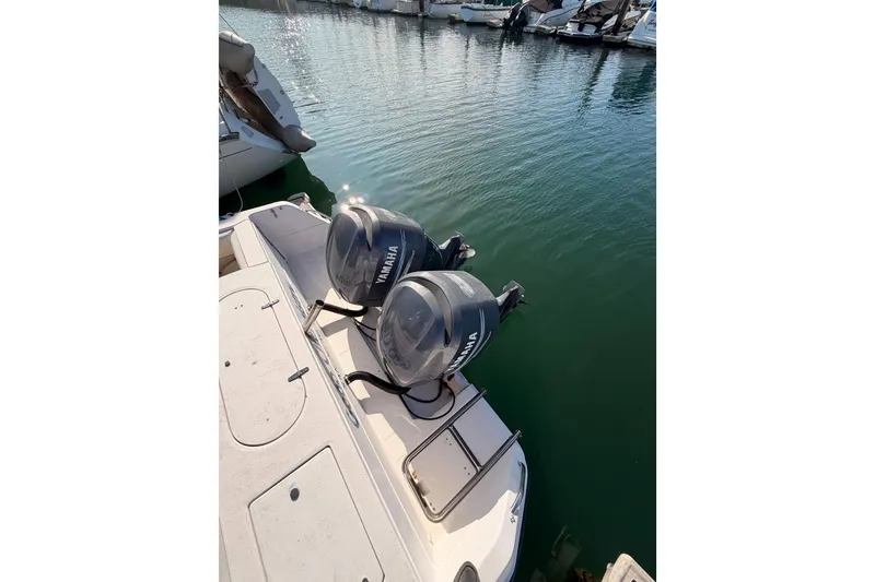 Slide: The Image of 1993 Grady-White Marlin 300 with twin Yamaha outboard motors docked in marina. - 8
