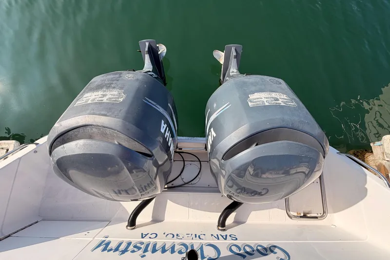 Slide: The Image of Two Yamaha outboard motors on a 1993 Grady-White Marlin 300 boat. - 9