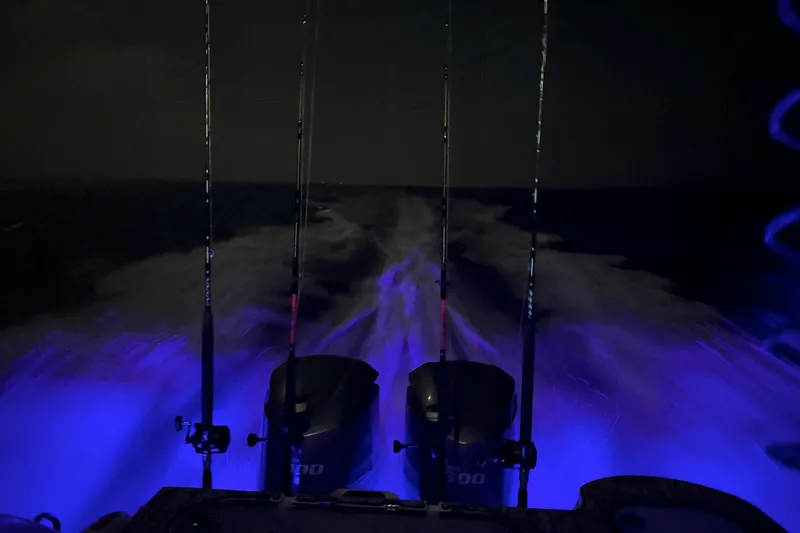 Slide: The Image of Night view of 2021 Sea Fox 288 Commander with illuminated wake and fishing rods. - 11